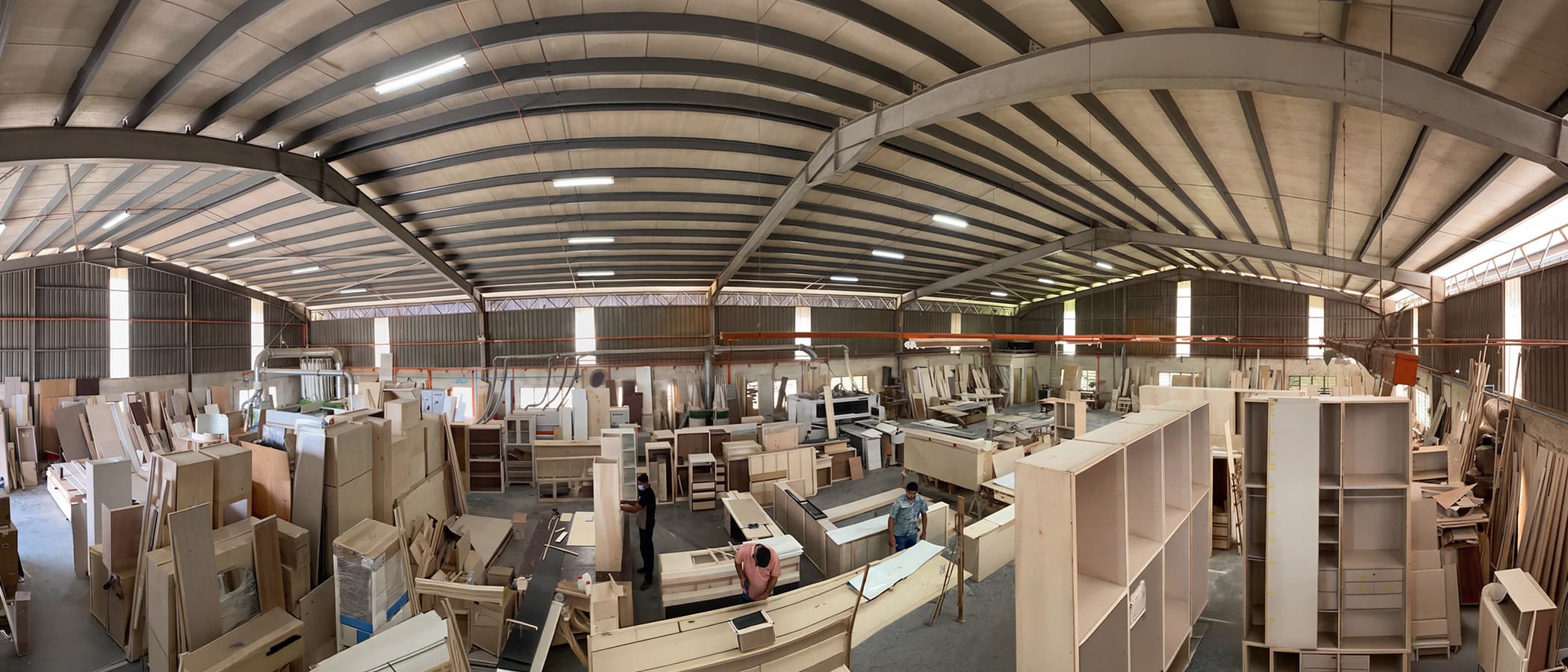 Mi Kuang carpenters building custom cabinetry in the workshop