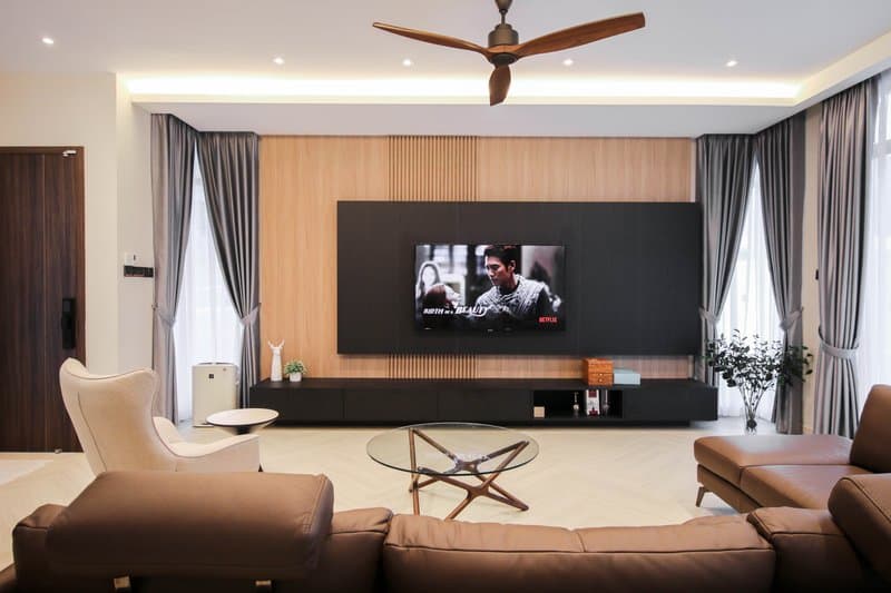 Custom TV console and feature wall with wood panel and ambient lighting