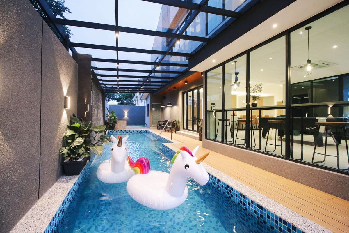 Covered poolside homestay with indoor-outdoor lounge area